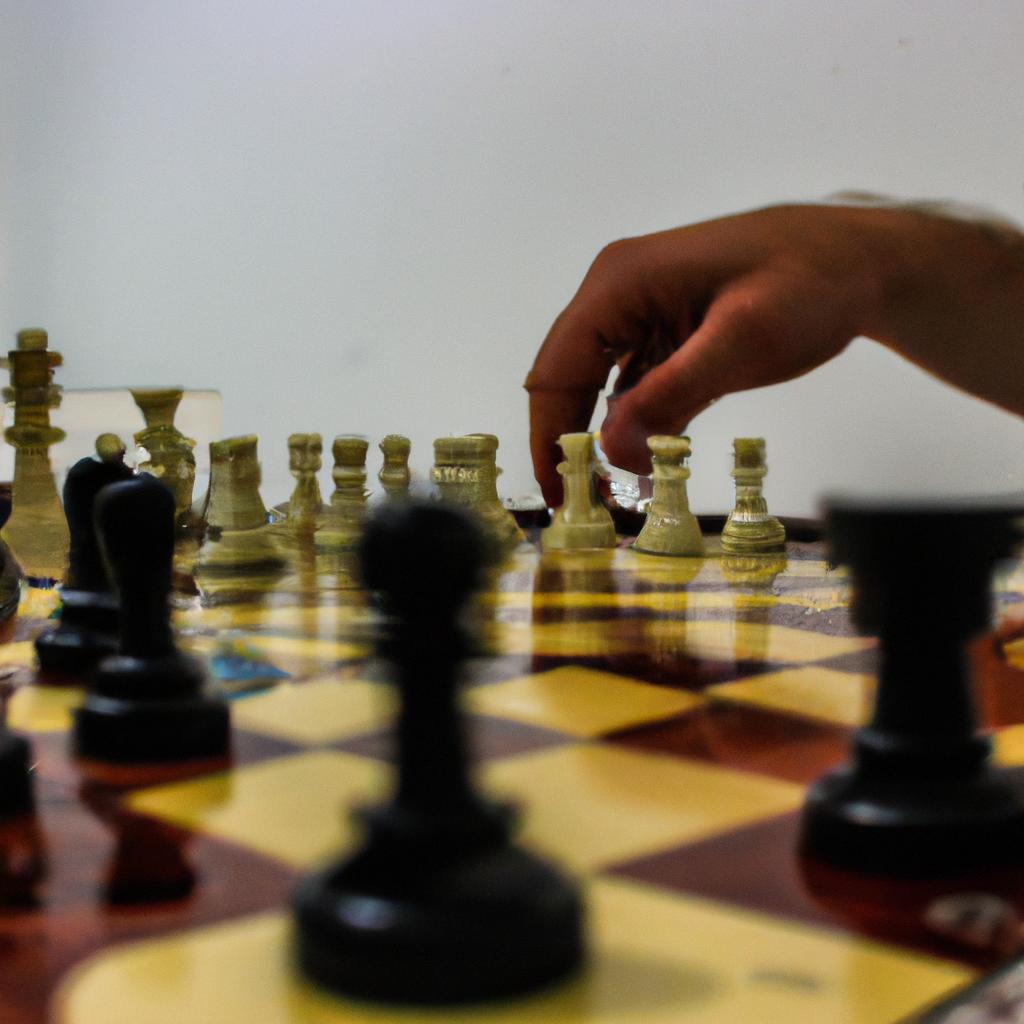 Person playing chess with focus